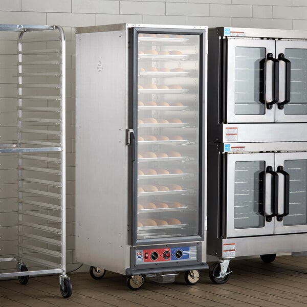 A Metro C5 1 Series proofing cabinet with a rack of bread.