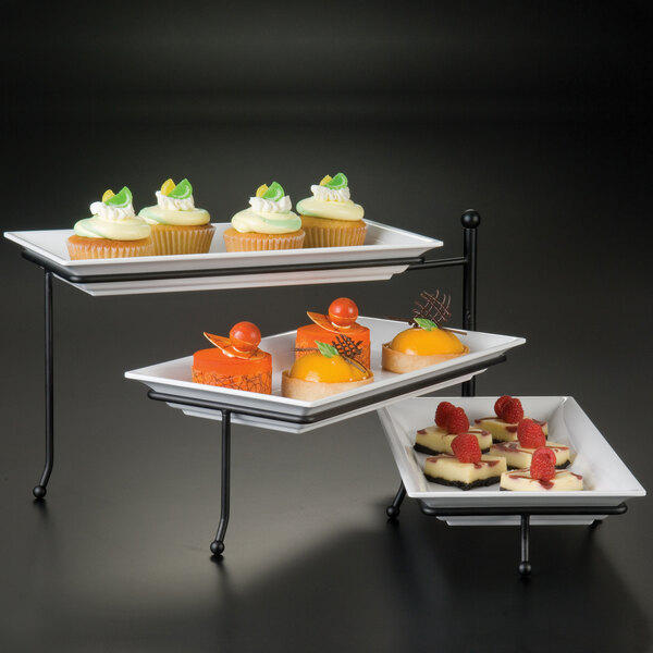An American Metalcraft three tier rectangular display stand with cupcakes and desserts.