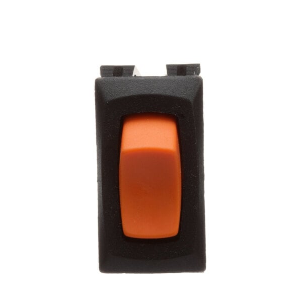 A close-up of an orange and black lighted rocker switch.