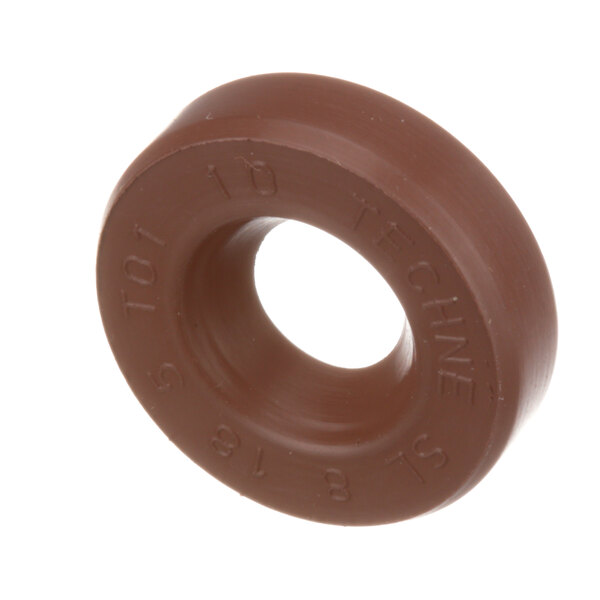 A brown circular Robot Coupe seal with the words 'tte' on it.