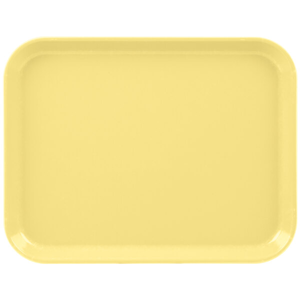A yellow Cambro tray with a white border.