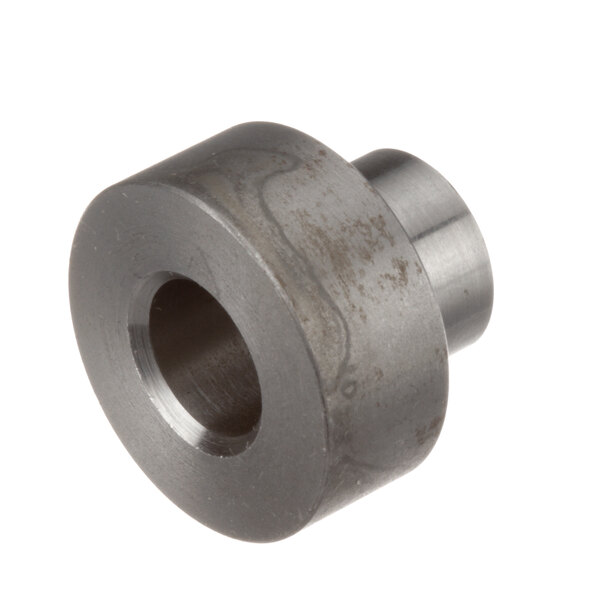 A Southbend bearing spacer, a round metal object with a hole in it.