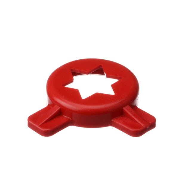 A red star shaped object with a hole in the middle.