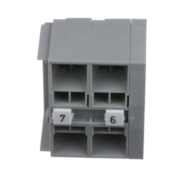 A grey plastic Hatco terminal block with white square holes and black numbers.