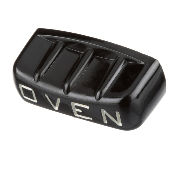 A black US Range knob with white text that says "Oven"