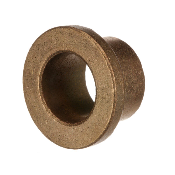 A close-up of a round bronze bushing with a hole in the middle.