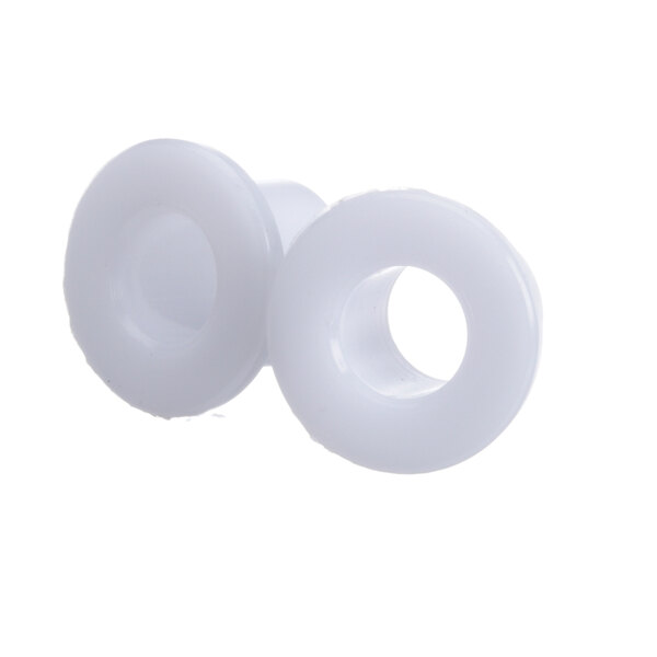 A close-up of a pair of white plastic plugs.