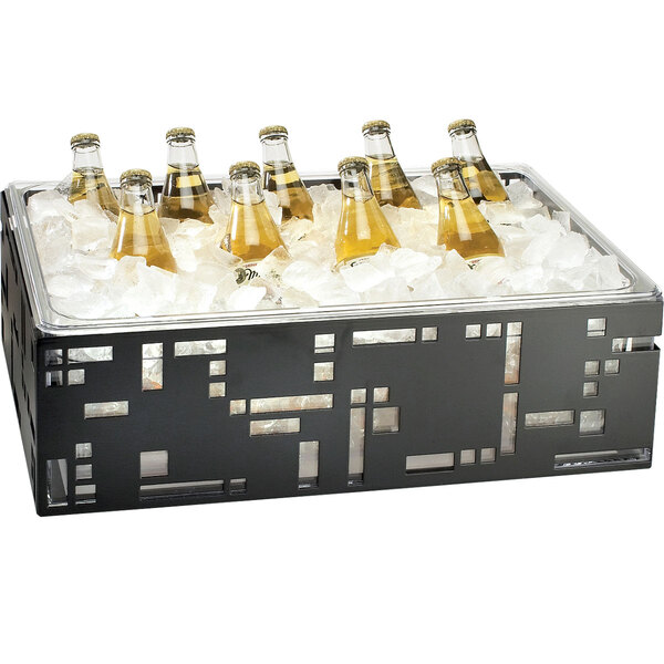 A Cal-Mil black metal ice housing with clear pan holding bottles of beer in ice.