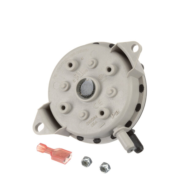 A grey circular Lochinvar air pressure switch with screws and nuts.