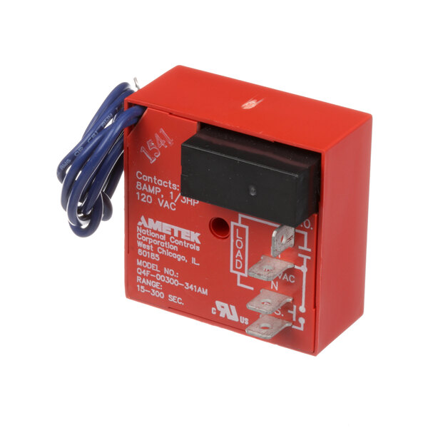 A red rectangular American Metal Ware timer with black and blue wires attached.