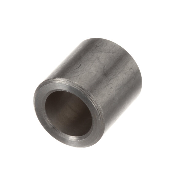 A close-up of a metal cylindrical spacer with a hole in it.