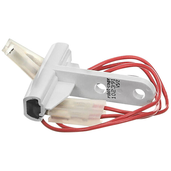 A white device with red and white wire connectors.