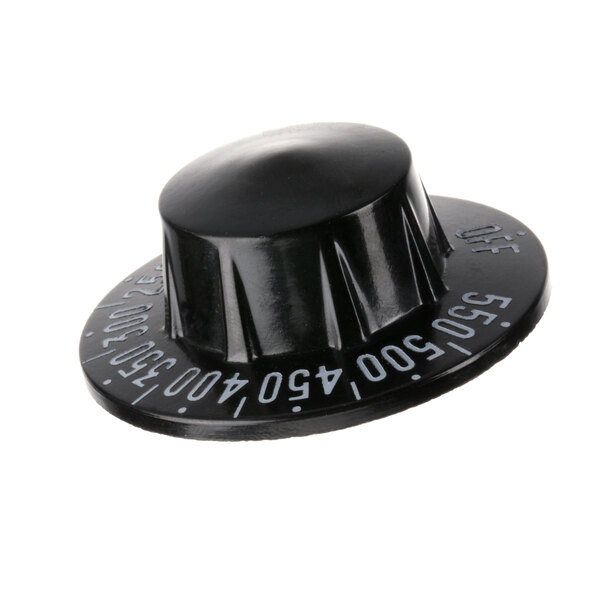 A black plastic Imperial thermostat knob with white numbers.