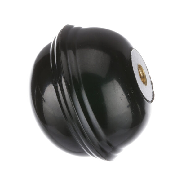 A black circular knob with a gold screw.