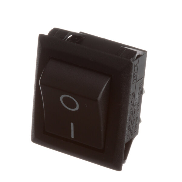 A black Structural Concepts main power switch with a white circle on the button.