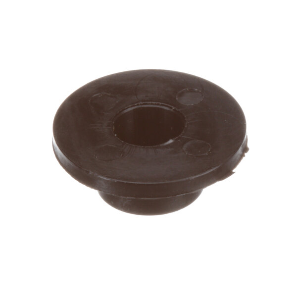 A black Groen T-Stat adapter grommet, a black round object with a hole in it.