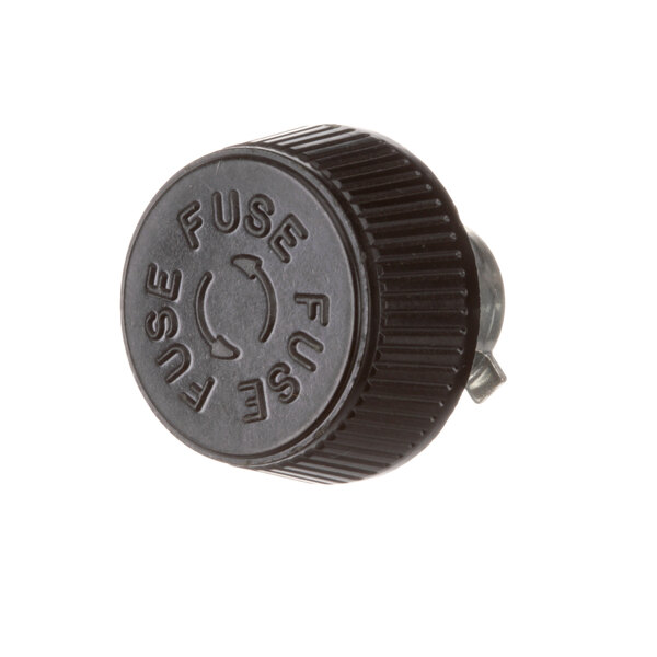 A black plastic US Range fuse holder with a circular arrow on it.