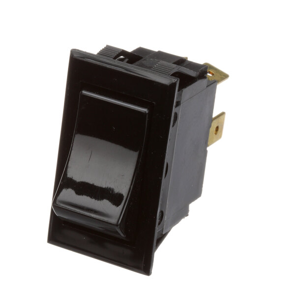 A black switch with a gold metal strip.