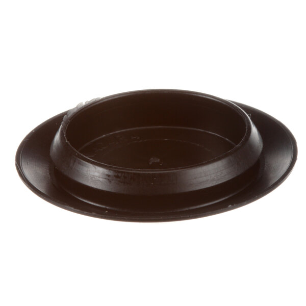 A black plastic cover with a black circle on top.
