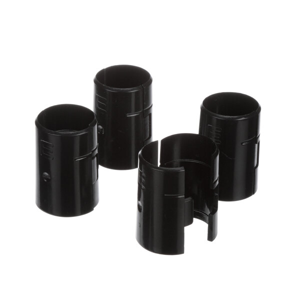 Three black plastic cylinders with a hole in the middle.