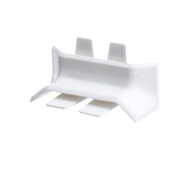White plastic Master-Bilt corner trim piece with three pointed tips.