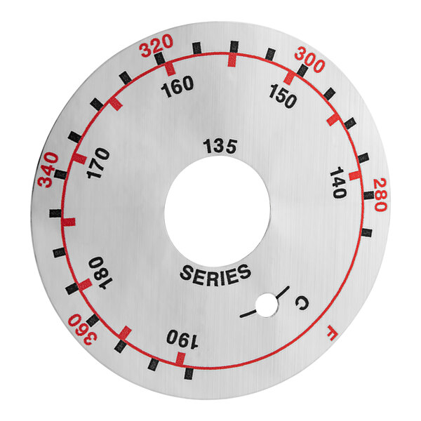 A circular metal dial plate with numbers and a hole in the middle.