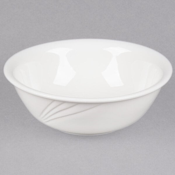 A CAC Garden State bone white porcelain bowl with a curved design.
