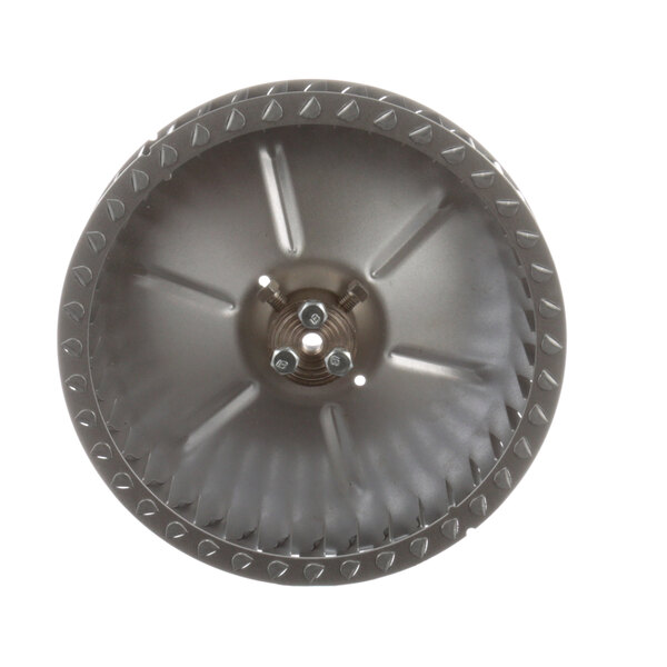A close-up of a circular metal blower wheel with spikes.