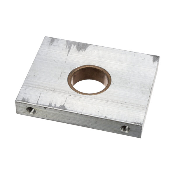 A metal square with a circular hole in it.