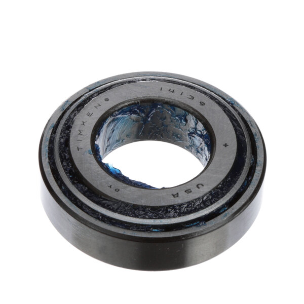 A close-up of a black and blue Salvajor top bearing cup.