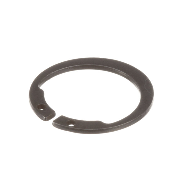 A close-up of a black metal Lincoln retaining ring with a hole in it.