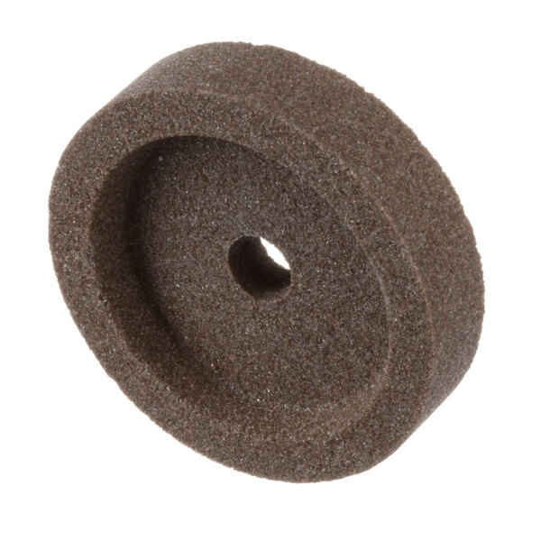A brown circular Berkel sharpening stone with a hole in it.