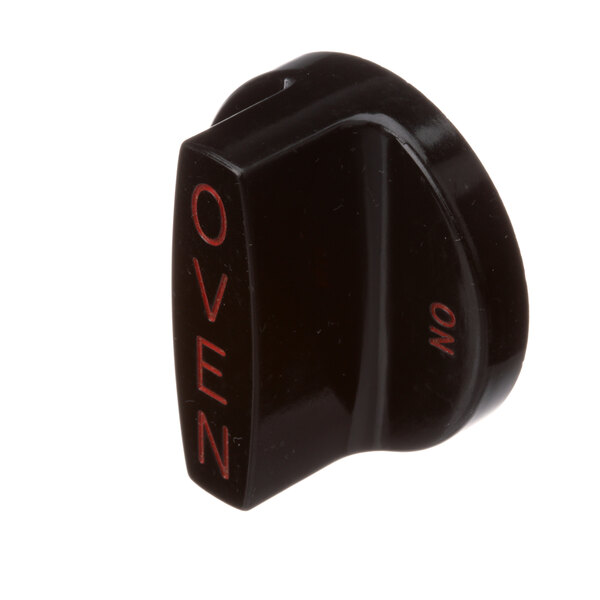 A black Southbend oven control knob with red text.