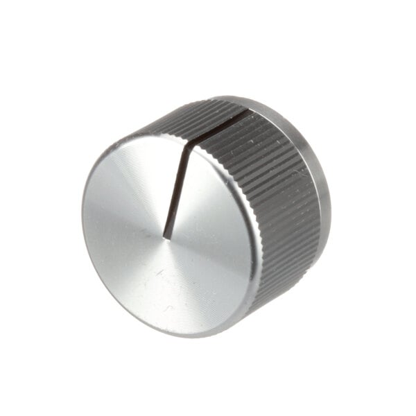A close-up of a silver Southbend knob with a hole.