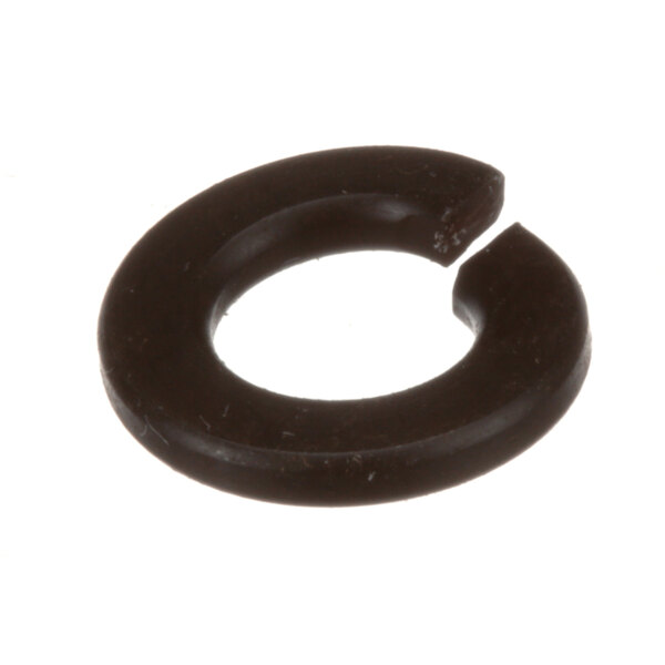 A close-up of a chocolate brown rubber washer with a broken hole in the center.
