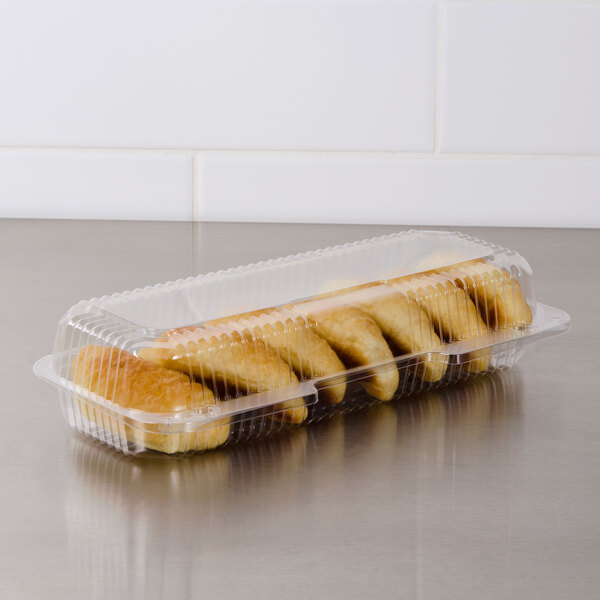A Dart clear plastic container of strudel.