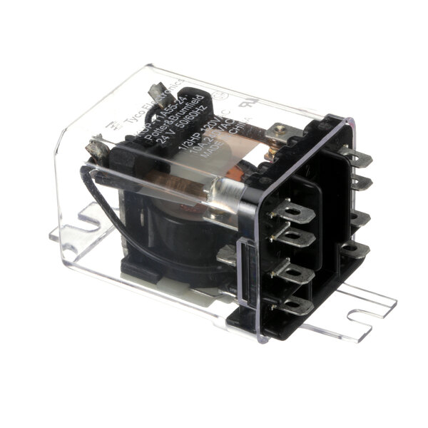 A Cornelius relay with a small metal case and black and white plastic cover.