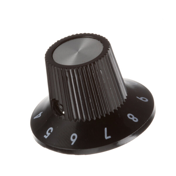 A black knob with silver numbers.