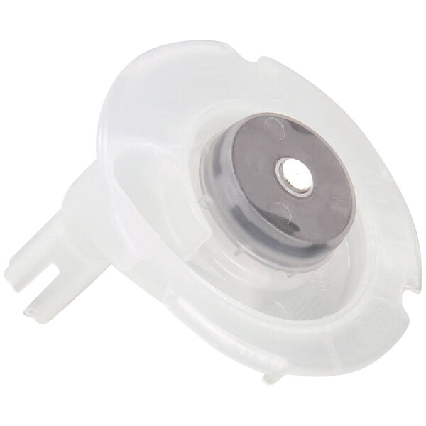 A white plastic Cornelius Impella water valve with a round metal disc.
