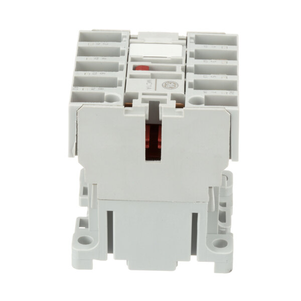 A close-up of a white Rational main contactor with two red switches.