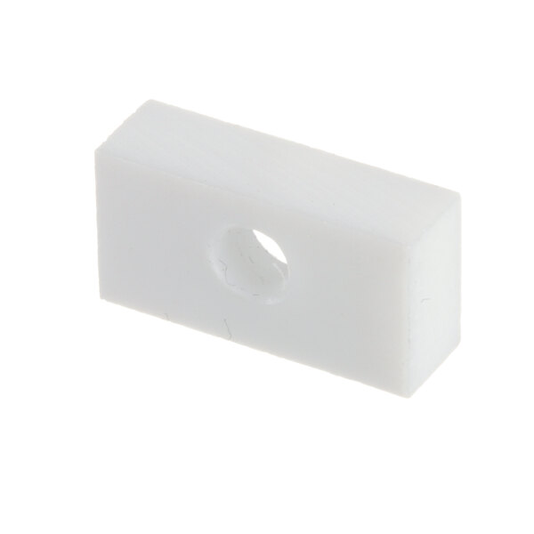 A white rectangular nylon block with a hole in it.
