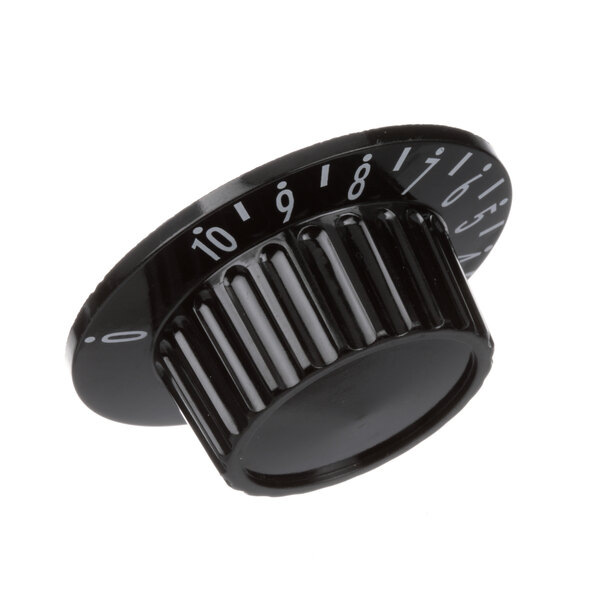 A black Groen thermostat knob with numbers on it.