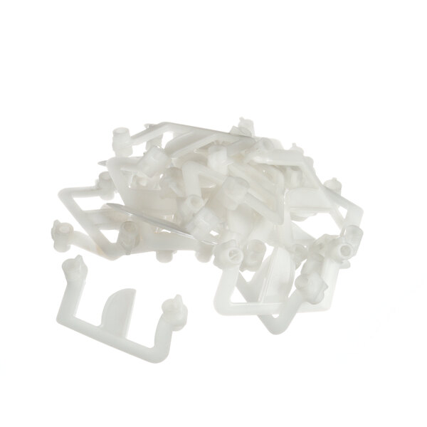 A pile of white plastic Blakeslee link parts.