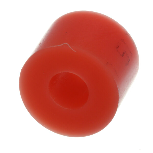 A red plastic wheel with a hole on a white background.