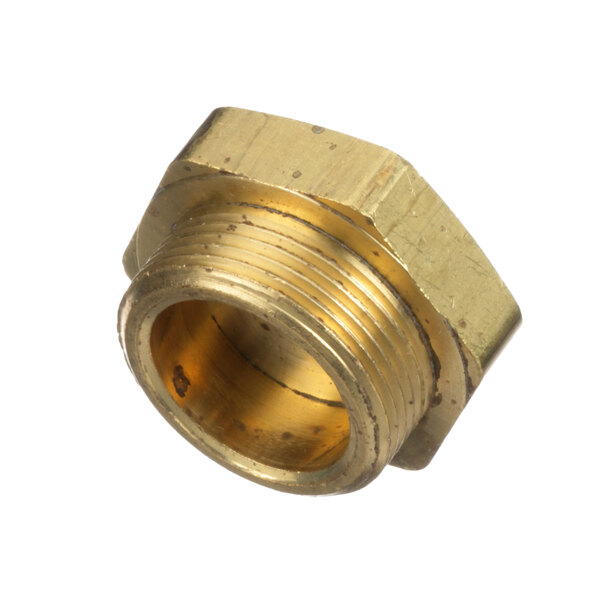 A close-up of a brass nut with a thread.