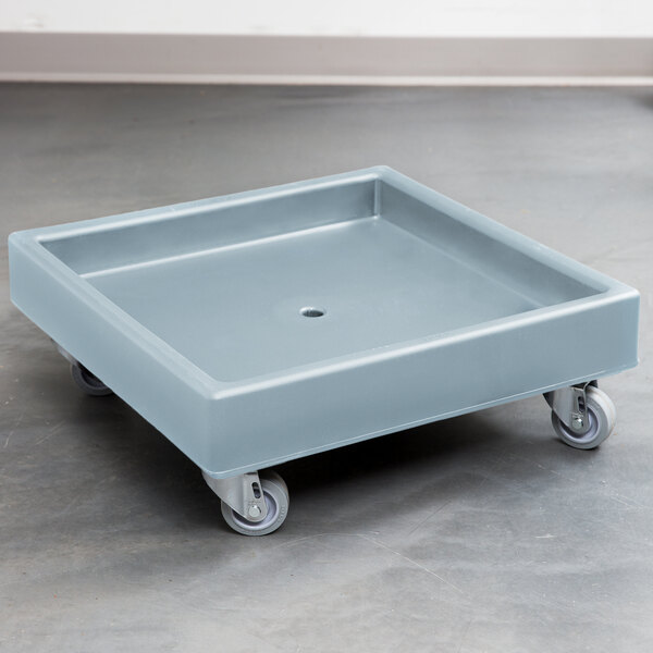 A slate blue plastic dolly with wheels.