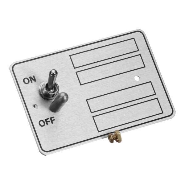 A metal plate with a switch and a knob.