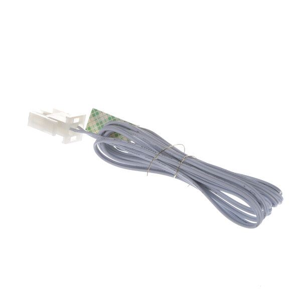 A white cable with a green connector on the end.