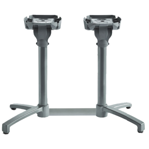Two Grosfillex X1 lateral silver gray aluminum table bases on a table.