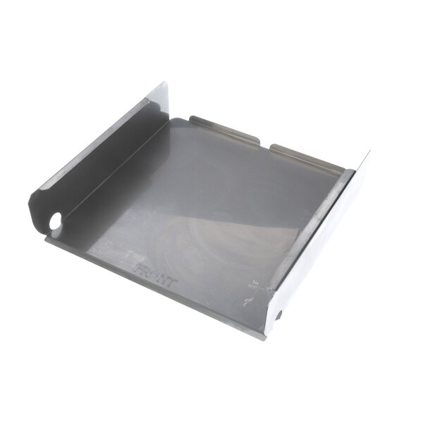 A metal tray with a small hole in it.